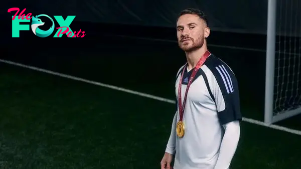 Brighton's Alexis Mac Allister with his World Cup medal for Argentina at an adidas shoot