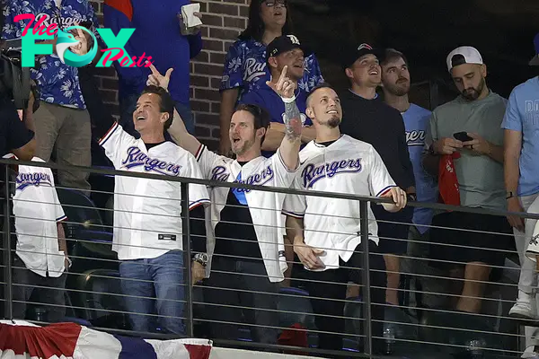 Creed lead vocalist Scott Stapp, bassist Brian Marshall and guitarist Mark Tremonti attend the American League Championship Series in Arlington, Texas on Oct. 18, 2023. 