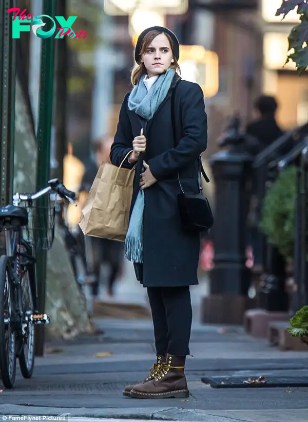 Barefaced chic: Emma opted for very little makeup and gave her ensemble a casual edge with brown lace-up boots