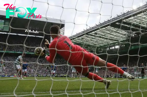 Jack Butland of Rangers saves Matt O'Riley's penalty during the Cinch Scottish Premiership match between Celtic FC and Rangers FC at Celtic Park St...