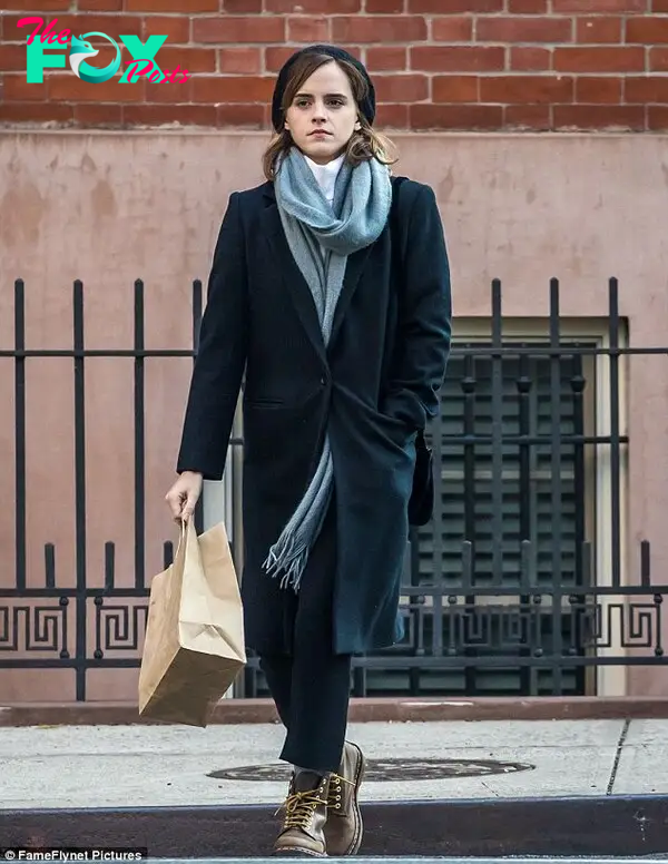 Effortless: Emma Watson wrapped up in stylish layers on Monday as she did a spot of shopping in New York