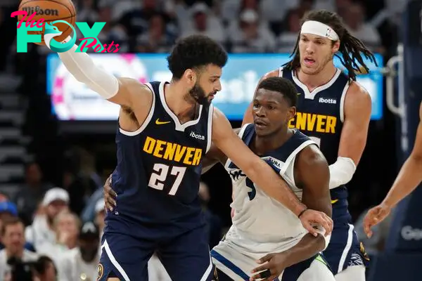 Denver Nuggets guard Jamal Murray (27) works around Minnesota Timberwolves guard Anthony Edwards (5) as forward Aaron Gordon (50) sets a pick in the third quarter of game four of the second round for the 2024 NBA playoffs at Target Center.