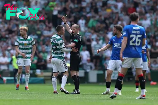 Referee, William Collum shows a yellow card to Callum McGregor of Celtic during the Cinch Scottish Premiership match between Celtic FC and Rangers ...