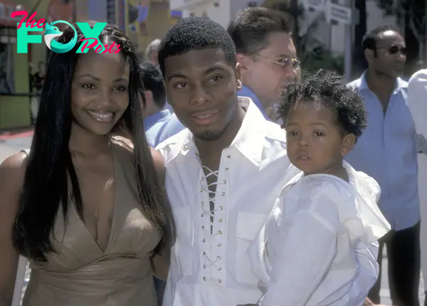 Kel Mitchell, Tyisha Hampton and their daughter at a premiere in 2000.