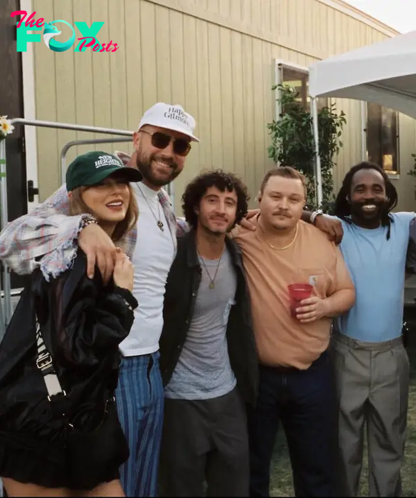 Taylor Swift and Travis Kelce posing with friends