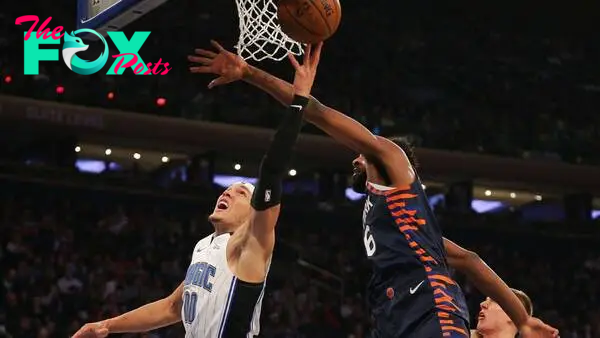 Feb 26, 2019; New York, NY, USA; Orlando Magic forward Aaron Gordon (00) goes up for a shot while being defended by New York Knicks center Mitchell Robinson (26) during the first half at Madison Square Garden. Mandatory Credit: Andy Marlin-USA TODAY Sports