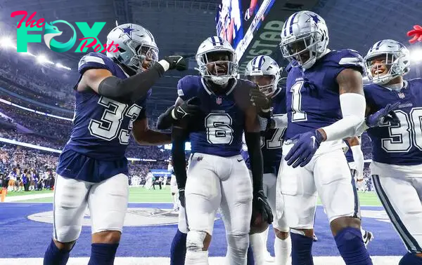 Dec 30, 2023; Arlington, Texas, USA; Dallas Cowboys safety Donovan Wilson (6) celebrates with teammates after making an interception during the second half against the Detroit Lions at AT&T Stadium. Mandatory Credit: Kevin Jairaj-USA TODAY Sports