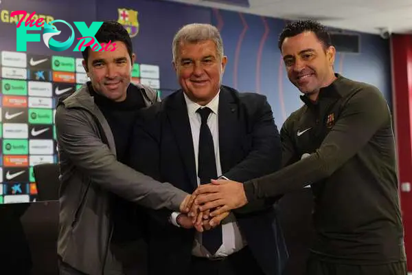 (From L) Barcelona's Sports Director Anderson de Souza "Deco", FC Barcelona President Joan Laporta and Barcelona's Spanish coach Xavi pose for pictures before a press conference at the Joan Gamper training ground in Sant Joan Despi, near Barcelona, on April 25, 2024. Xavi will remain as coach of Barcelona, the Spanish giants told AFP on April 24, despite having announced in January that he planned to quit at the end of the season due to the "cruel and unpleasant" nature of the job. (Photo by LLUIS GENE / AFP)