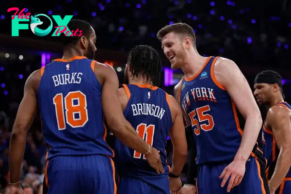 NEW YORK, NEW YORK - MAY 14: Jalen Brunson #11, Isaiah Hartenstein #55, and Alec Burks #18 of the New York Knicks 