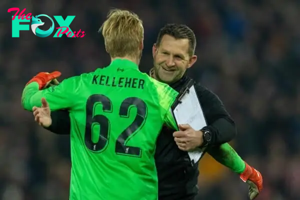 LIVERPOOL, ENGLAND - Wednesday, December 22, 2021: Liverpool's goalkeeper Caoimhin Kelleher is embraced by goalkeeping coach John Achterberg after the penalty shoot-out during the Football League Cup Quarter-Final match between Liverpool FC and Leicester City FC at Anfield. (Pic by David Rawcliffe/Propaganda)