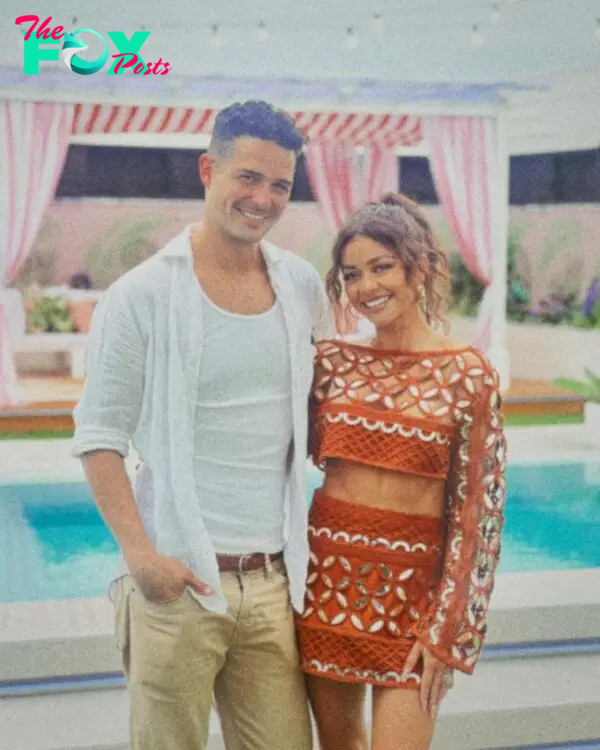 Sarah Hyland and Wells Adams near the pool.