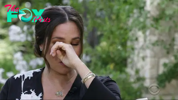 Meghan Markle wiping her eye