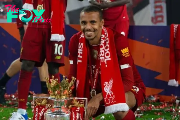 LIVERPOOL, ENGLAND - Wednesday, July 22, 2020: Liverpool’s Joel Matip celebrates with the Premier League trophy as the Reds are crowned Champions after the FA Premier League match between Liverpool FC and Chelsea FC at Anfield. The game was played behind closed doors due to the UK government’s social distancing laws during the Coronavirus COVID-19 Pandemic. Liverpool won 5-3. (Pic by David Rawcliffe/Propaganda)