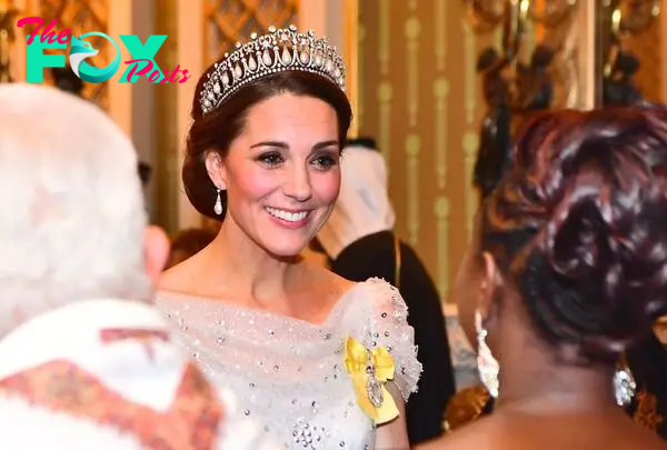 Kate Middleton in a tiara smiling 