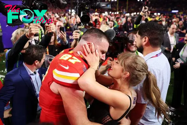 Travis Kelce kisses Taylor Swift after winning the Super Bowl.