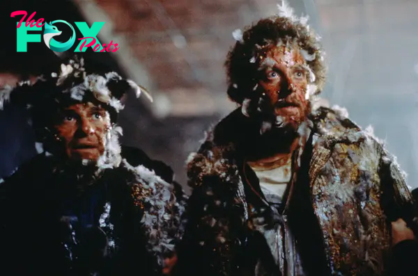 Joe Pesci and Daniel Stern, covered in feathers in a scene from "Home Alone 2: Lost in New York."