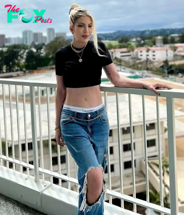 Tori Spelling wearing a crop top