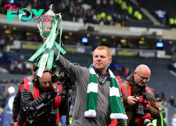 Neil Lennon, manager of Celtic poses with the Scottish Cup at the final whistle during the Scottish Cup Final between Heart of Midlothian FC and Ce...