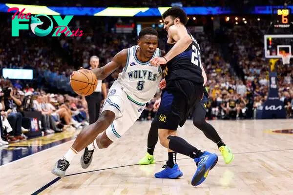 DENVER, COLORADO - MAY 19: Anthony Edwards #5 of the Minnesota Timberwolves drives to the basket against Jamal Murray #27 of the Denver Nuggets during the fourth quarter in Game Seven of the Western Conference Second Round Playoffs at Ball Arena on May 19, 2024 in Denver, Colorado. NOTE TO USER: User expressly acknowledges and agrees that, by downloading and or using this photograph, User is consenting to the terms and conditions of the Getty Images License Agreement.   C. Morgan Engel/Getty Images/AFP (Photo by C. Morgan Engel / GETTY IMAGES NORTH AMERICA / Getty Images via AFP)