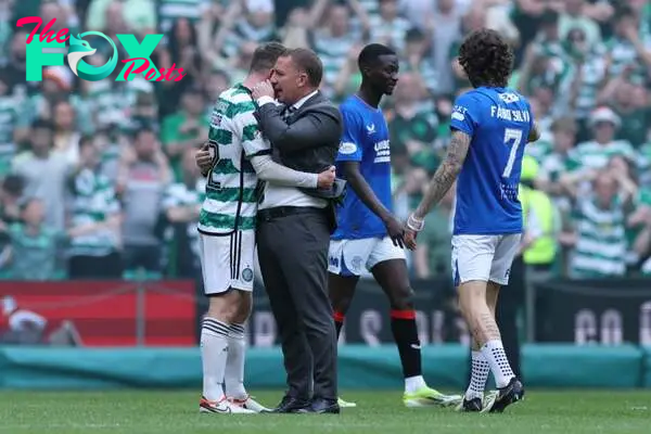 Callum McGregor of Celtic and Brendan Rodgers, Manager of Celtic, embrace following the team's victory during the Cinch Scottish Premiership match ...