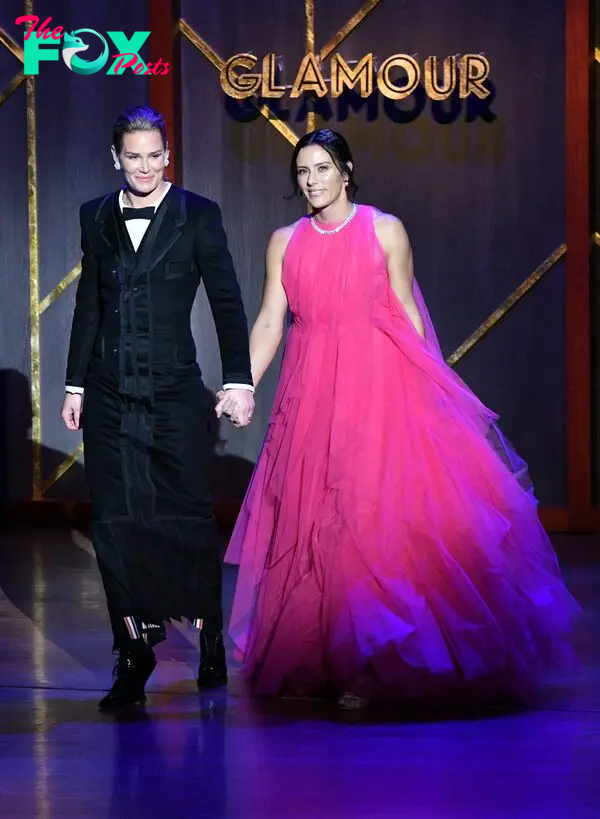 Ashlyn Harris and Ali Krieger walk onstage at the 2019 Glamour Women Of The Year Awards.