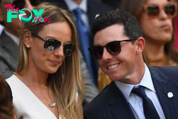 Irish golfer Rory McIlroy and their wife Erica sit on the center court to watch Serbia's Novak Djokovic play Japan's Kei Nishikori during their men's singles quarter-finals match on the ninth day of the 2018 Wimbledon Championships at The All England Lawn Tennis Club in Wimbledon, southwest London, on July 11, 2018., 2024.