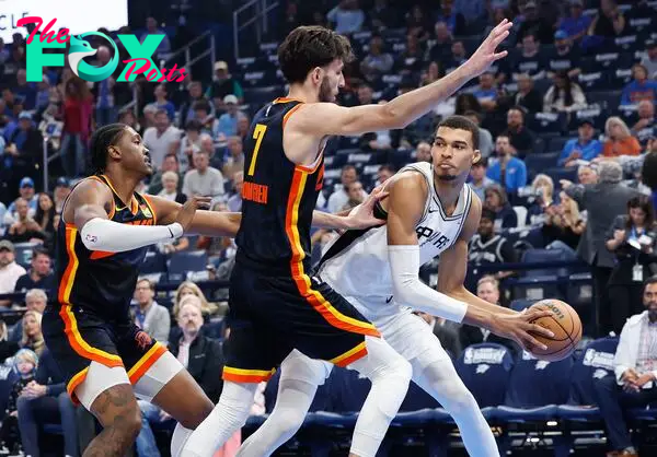 Oklahoma City Thunder forward Chet Holmgren (7) defends a pass by San Antonio Spurs center Victor Wembanyama (1) during the first quarter at Paycom Center.