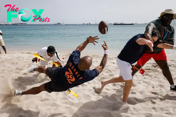 Damaune Journey catching a football on the beach