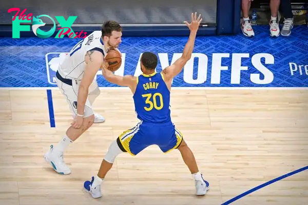 May 24, 2022; Dallas, Texas, USA; Golden State Warriors guard Stephen Curry (30) guards Dallas Mavericks guard Luka Doncic (77) during the fourth quarter in game four of the 2022 western conference finals at American Airlines Center. Mandatory Credit: Jerome Miron-USA TODAY Sports