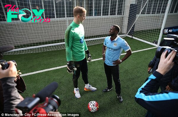 Actor Kevin Hart (right) looks up to namesake Joe as the actor visited Manchester City's training ground