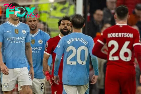 LIVERPOOL, ENGLAND - Sunday, March 10, 2024: Liverpool's Mohamed Salah (L) clashes with Manchester City's Bernardo Silva during the FA Premier League match between Liverpool FC and Manchester City FC at Anfield. (Photo by David Rawcliffe/Propaganda)