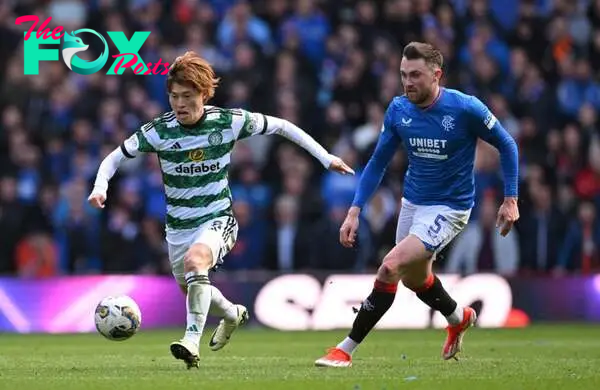 Celtic player Kyogo Furuhashi (l) is challenged by John Souttar of Rangers during the Cinch Scottish Premiership match between Rangers FC and Celti...