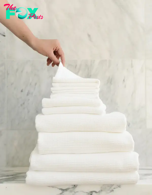 A pile of white waffle-weave towels
