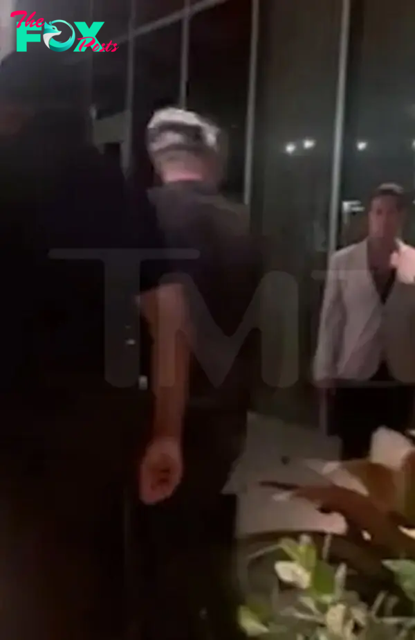 Kendall Jenner and Bad Bunny exiting a restaurant in Miami