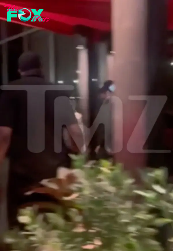 Kendall Jenner and Bad Bunny exiting a restaurant in Miami