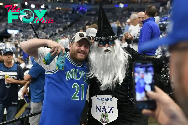 Minnesota Timberwolves fans pose prior to a game against the Dallas Mavericks