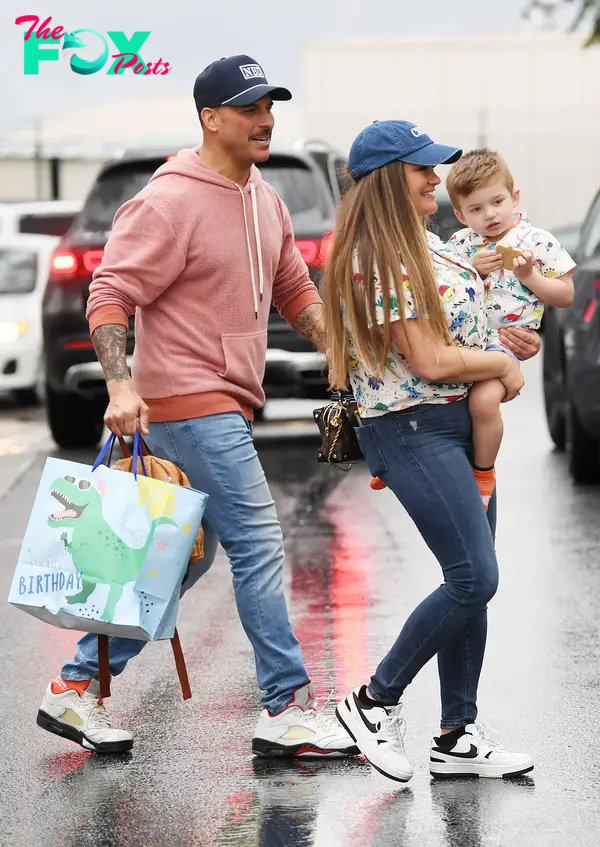Jax Taylor and Brittany Cartwright walking with their son, Cruz