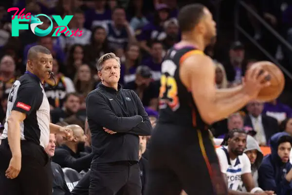 Head coach Chris Finch of the Minnesota Timberwolves looks on