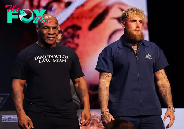 Mike Tyson and Jake Paul at a press conference. 