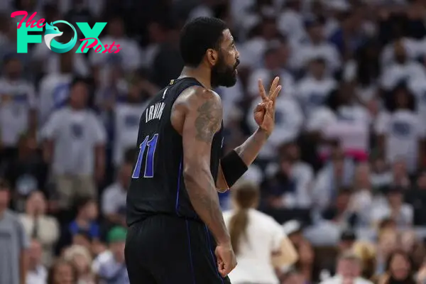 Dallas Mavericks guard Kyrie Irving (11) reacts 