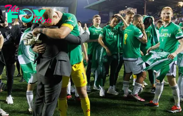 Celtic's Joe Hart and Manager Brendan Rodgers celebrate winning the Scottish Premiership after the Cinch Scottish Premiership match between Kilmarn...