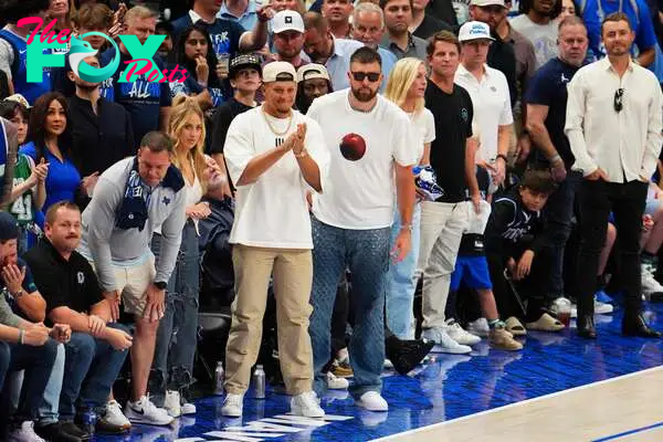 DALLAS, TEXAS - MAY 26: Patrick Mahomes and Travis Kelce of the Kansas City Chiefs look on during the fourth quarter of Game Three of the Western Conference Finals between the Dallas Mavericks and the Minnesota Timberwolves at American Airlines Center on May 26, 2024 in Dallas, Texas. NOTE TO USER: User expressly acknowledges and agrees that, by downloading and or using this photograph, User is consenting to the terms and conditions of the Getty Images License Agreement.   Cooper Neill/Getty Images/AFP (Photo by Cooper Neill / GETTY IMAGES NORTH AMERICA / Getty Images via AFP)