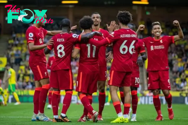 NORWICH, ENGLAND - Saturday, August 14, 2021: Liverpool's Mohamed Salah (#11) celebrates with team-mates after scoring the third goal during the FA Premier League match between Norwich City FC and Liverpool FC at Carrow Road. (Pic by David Rawcliffe/Propaganda)