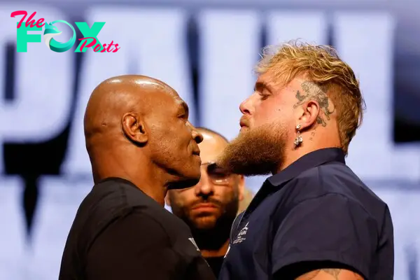 Jake Paul and Mike Tyson at a press conference. 