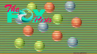 12 colored spheres (4 red, 4 purple, 4 green) with a striped green background. Although they look like different colors, all the spheres are actually beige