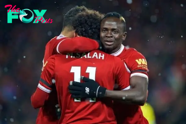 LIVERPOOL, ENGLAND - Saturday, March 17, 2018: Liverpool's Mohamed Salah celebrates scoring the fourth goal, the third of his hat-trick, with team-mates Alex Oxlade-Chamberlain (left) and Sadio Mane (right) during the FA Premier League match between Liverpool FC and Watford FC at Anfield. (Pic by David Rawcliffe/Propaganda)