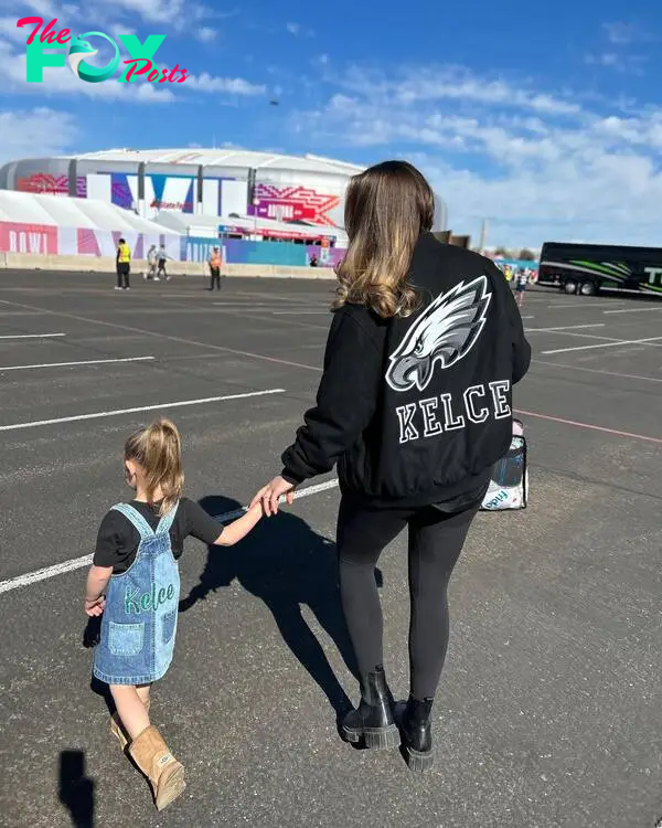 Kylie Kelce walking with her daughter