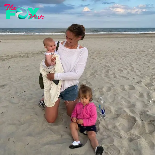 Kylie Kelce on the beach with her daughters