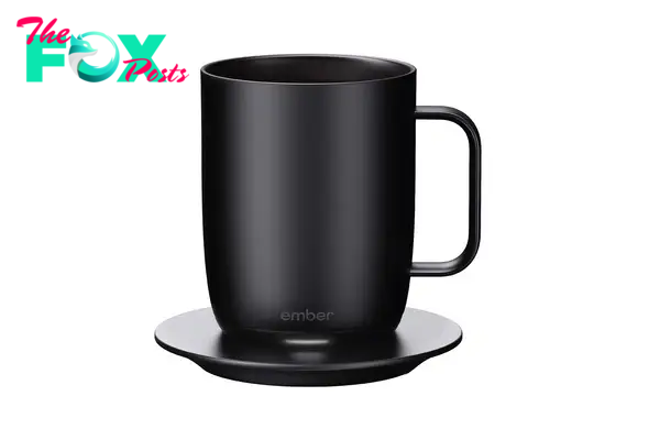 A black self-heating coffee mug