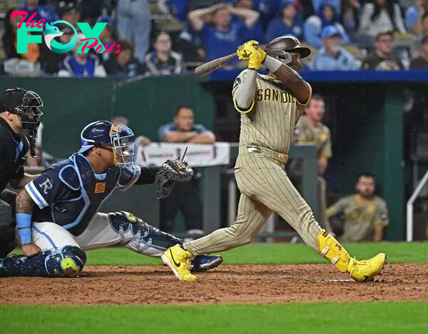 May 31, 2024; Kansas City, Missouri, USA;  San Diego Padres left fielder Jurickson Profar (10) hits an RBI single in the eighth inning against the Kansas City Royals at Kauffman Stadium. Mandatory Credit: Peter Aiken-USA TODAY Sports